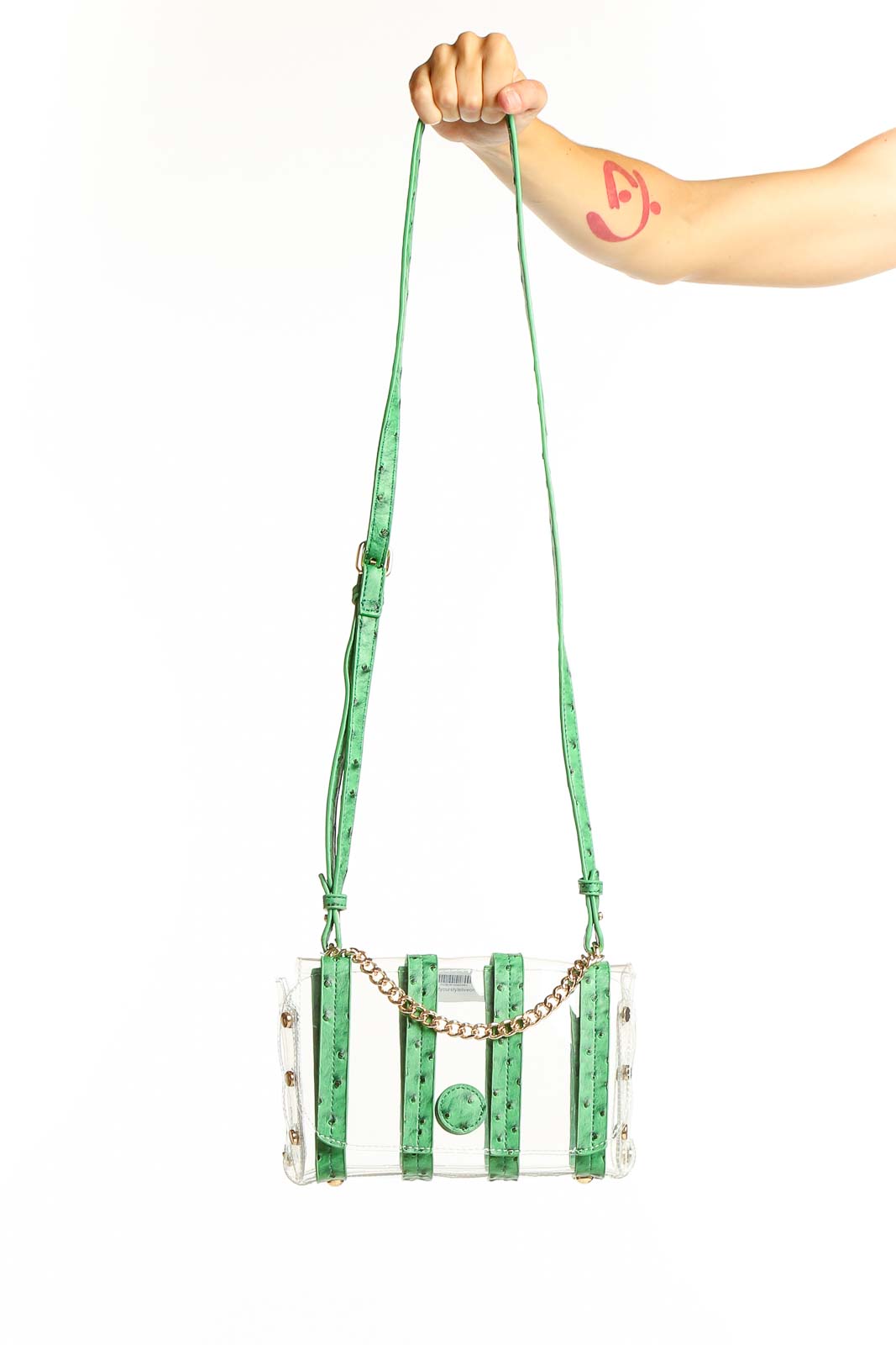 Front view of SilkRoll green transparent PVC crossbody bag with gold chain detail