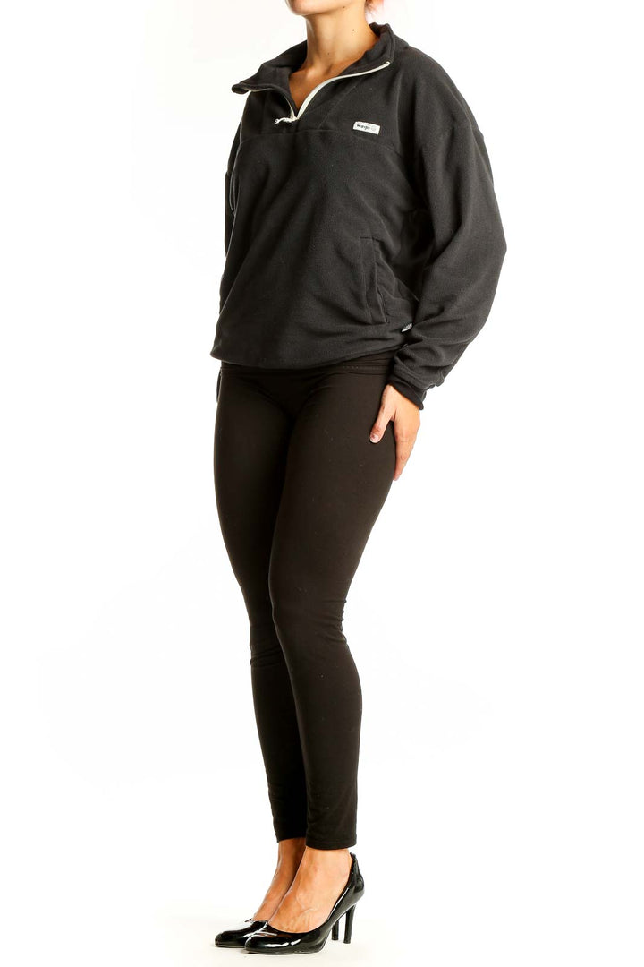 Front view of black Wrangler half-zip fleece pullover