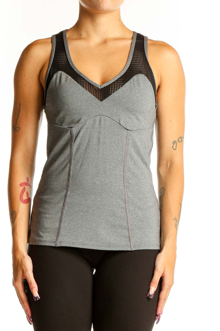 Front view of Trina Turk gray racerback tank top with mesh panel