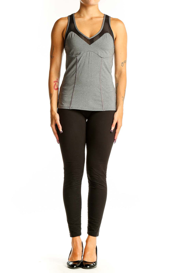 Front view of Trina Turk gray racerback tank top with mesh panel