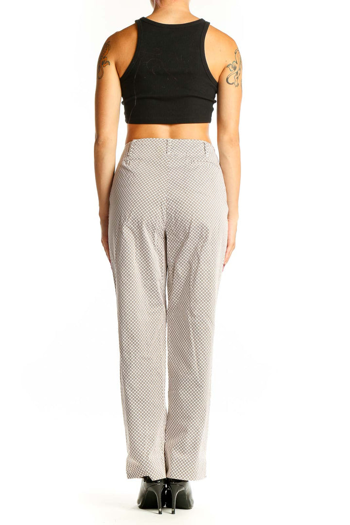 Side view of model wearing beige Talbots trousers with black top