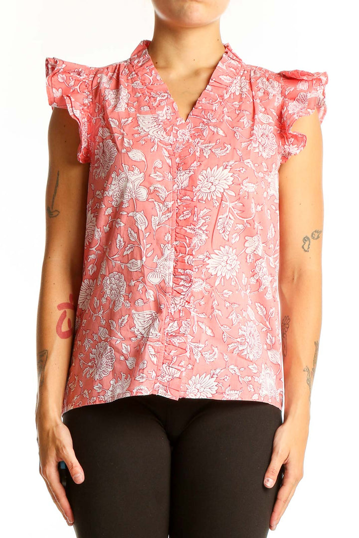 Front view of J.Crew pink floral cotton top with ruffle sleeves