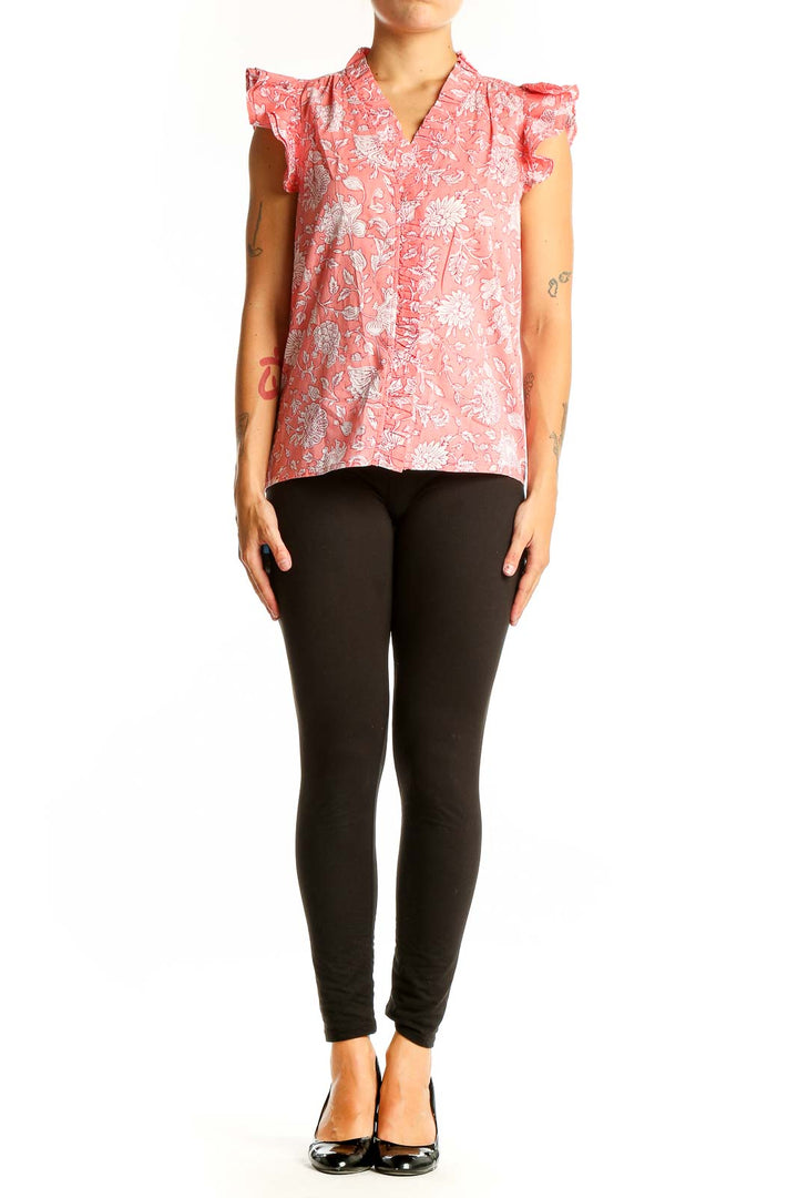 Front view of J.Crew pink floral cotton top with ruffle sleeves