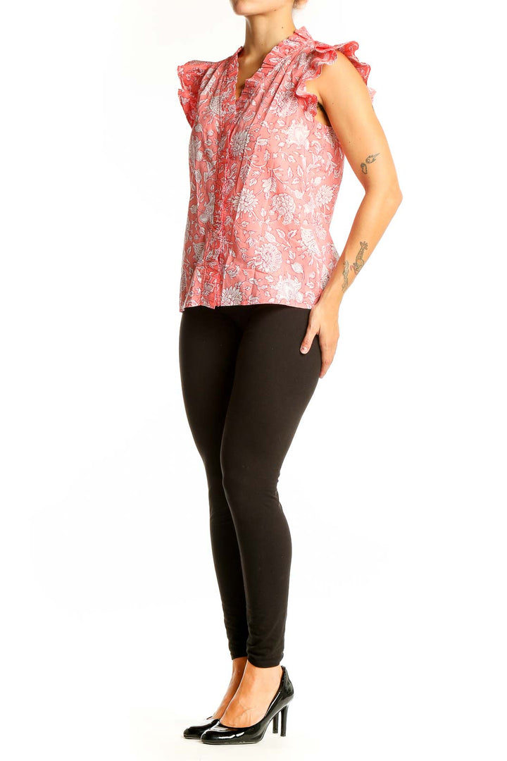 Front view of J.Crew pink floral cotton top with ruffle sleeves