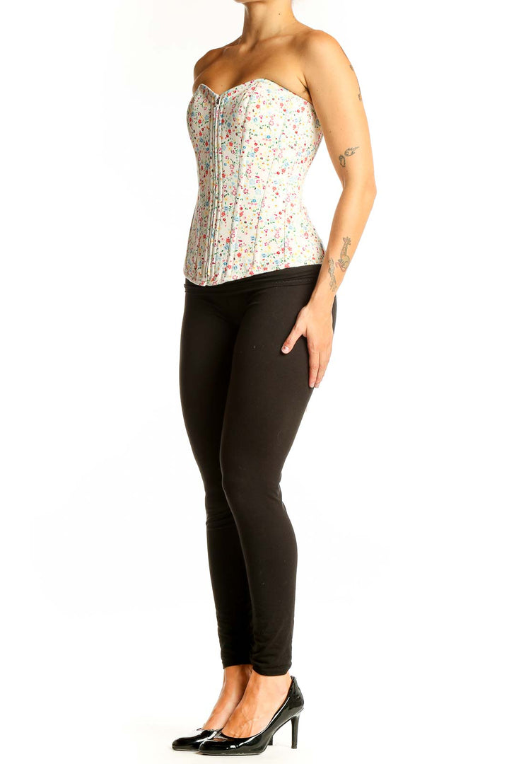 Front view of white floral cotton corset top with sweetheart neckline