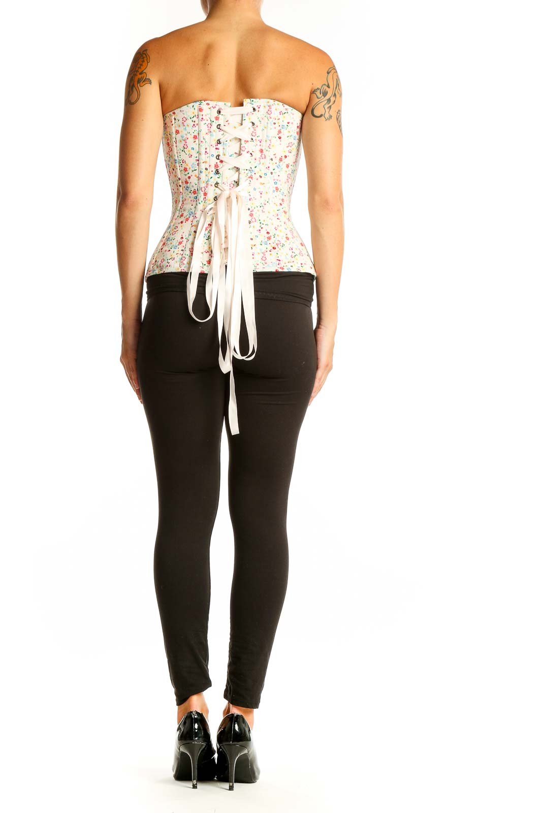 Side view of white floral cotton corset top showing fitted silhouette