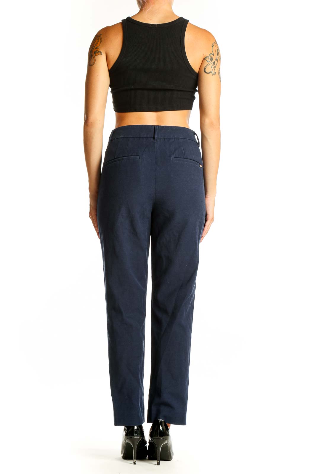 Side view of White House Black Market navy straight leg trousers on model with black top