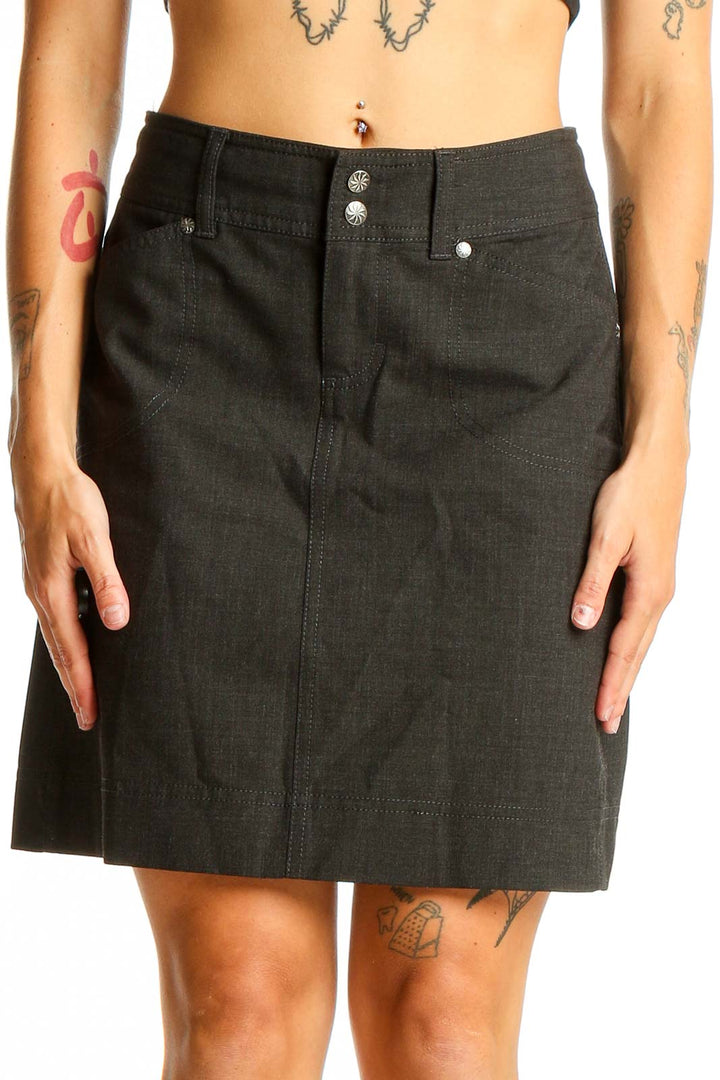 Front view of Athleta black A-line skirt with button detail