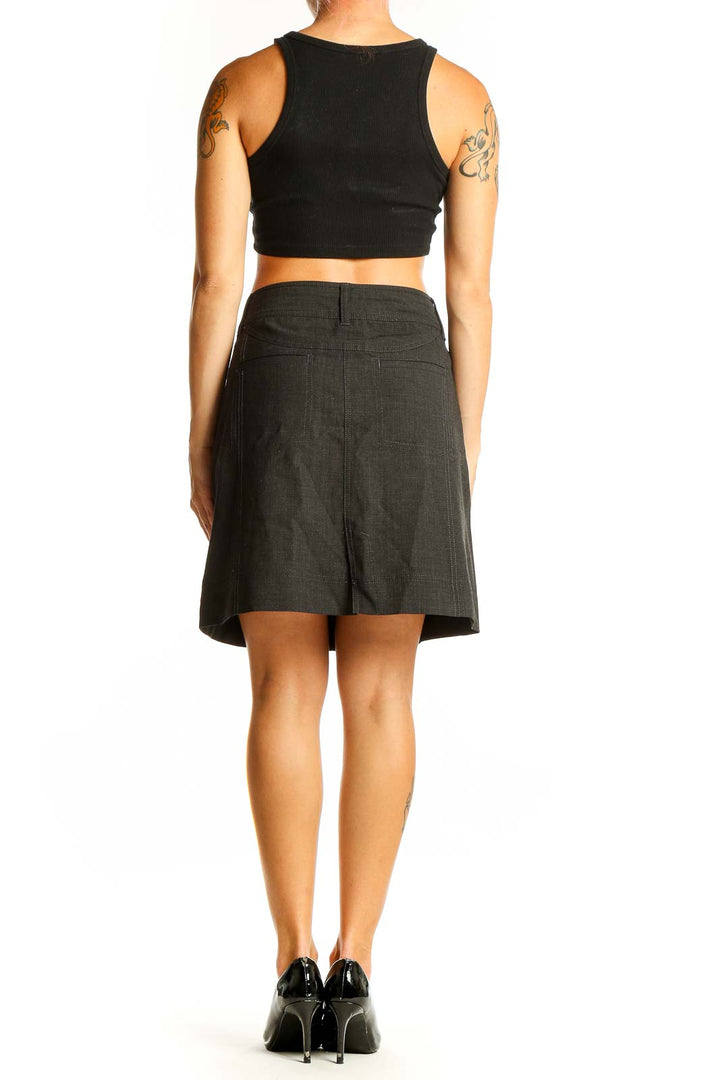 Side view of Athleta black A-line skirt on model