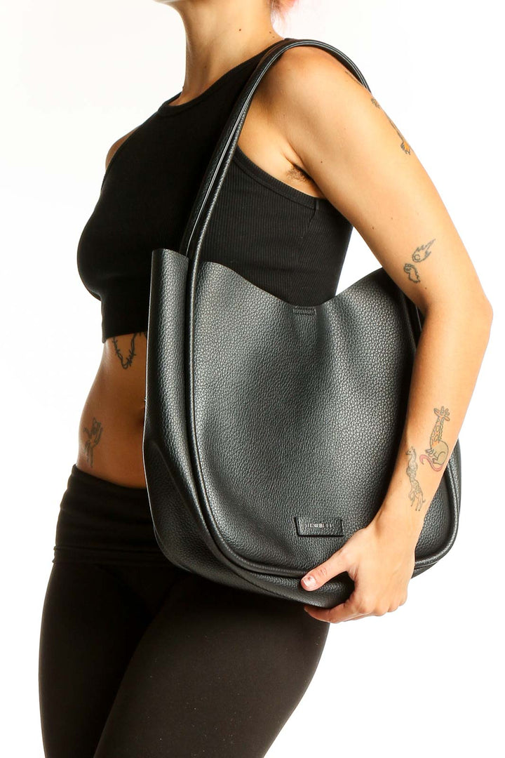 Front view of NEWBELLA black leather hobo tote bag