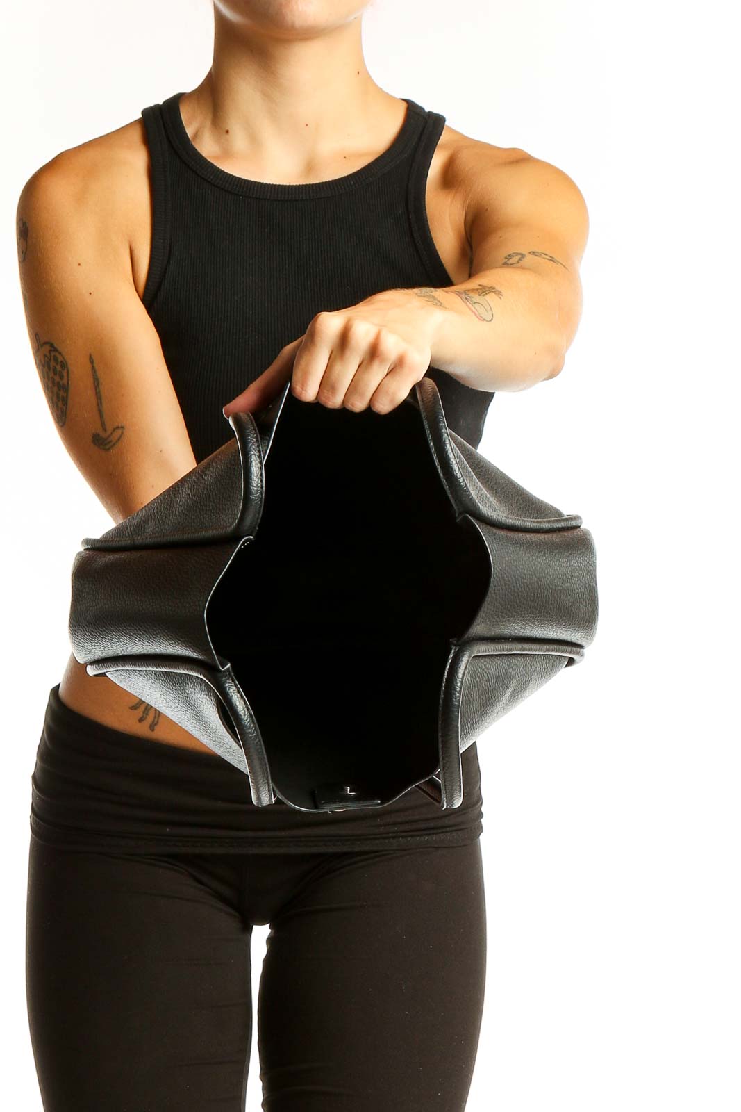 Side view of NEWBELLA black leather hobo tote bag worn on shoulder