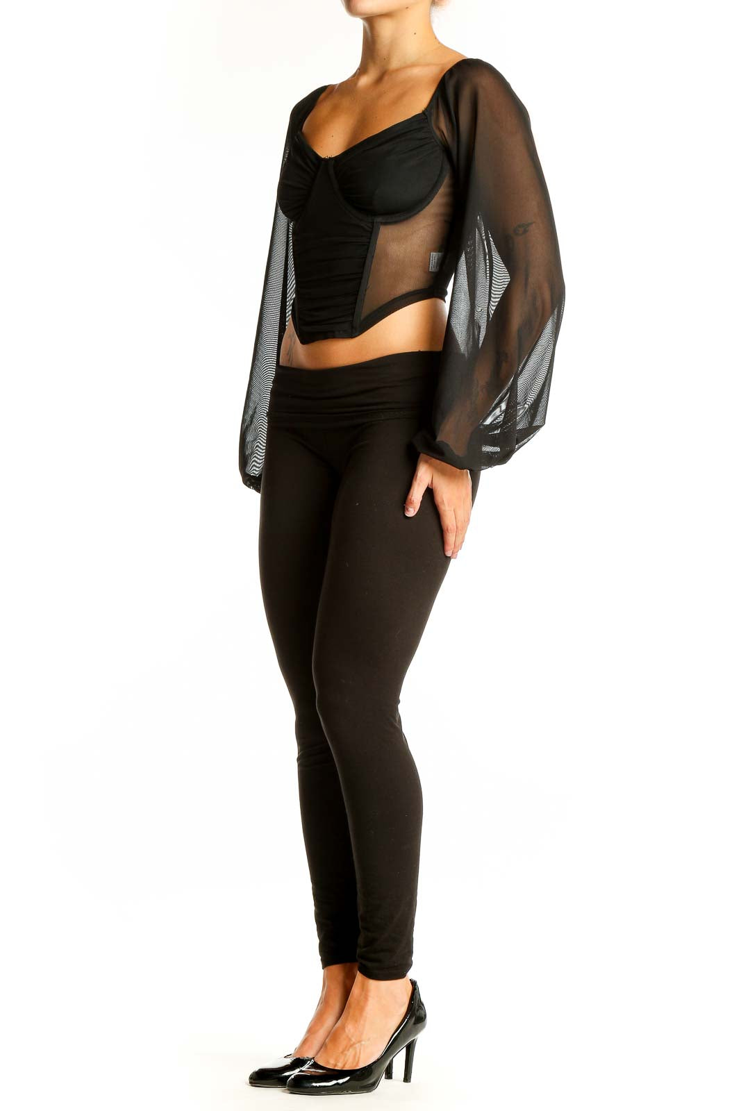 Front view of black crop top with sheer long sleeves and sweetheart neckline