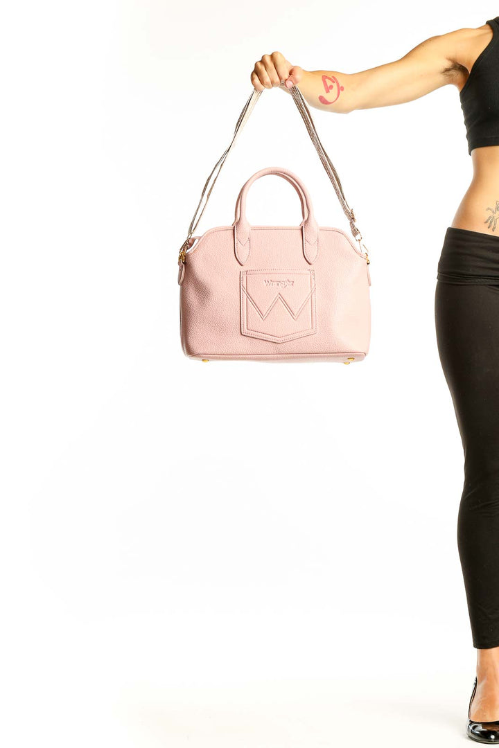 Front view of pink leather Wrangler satchel with W-shaped pocket