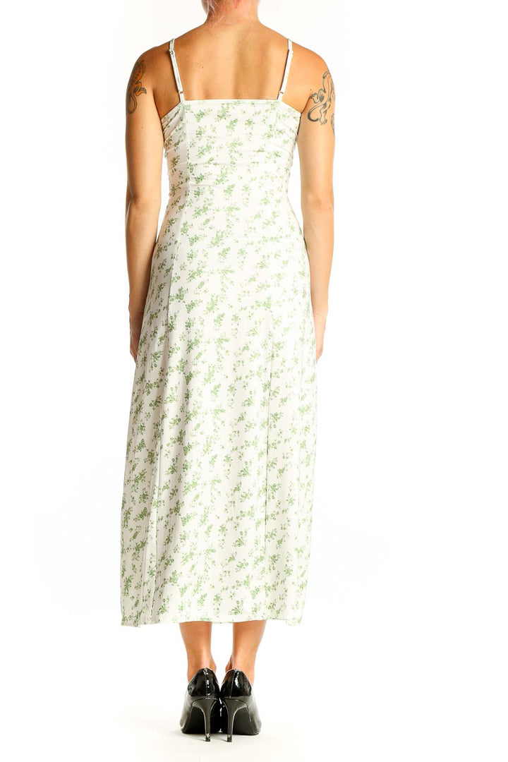 Side view of white floral print maxi dress showing side slit