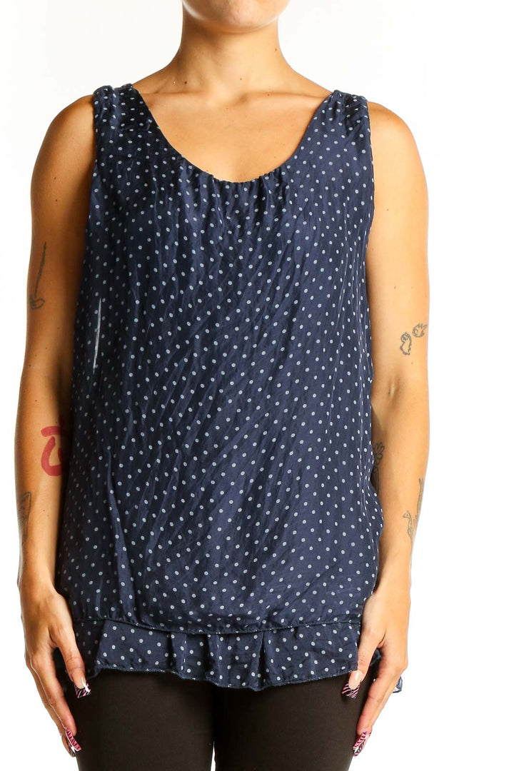 Front view of GIUSY navy sleeveless blouse with white polka dots