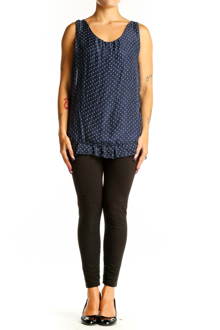 Front view of GIUSY navy sleeveless blouse with white polka dots