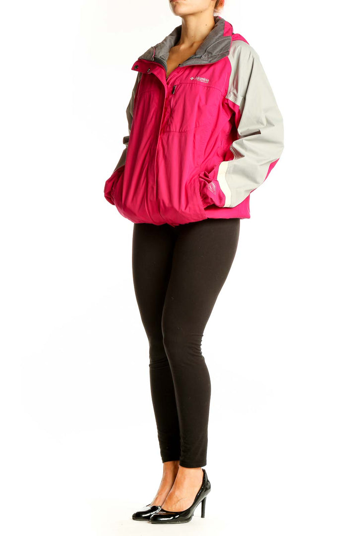 Front view of pink and gray Columbia nylon jacket with chest pocket