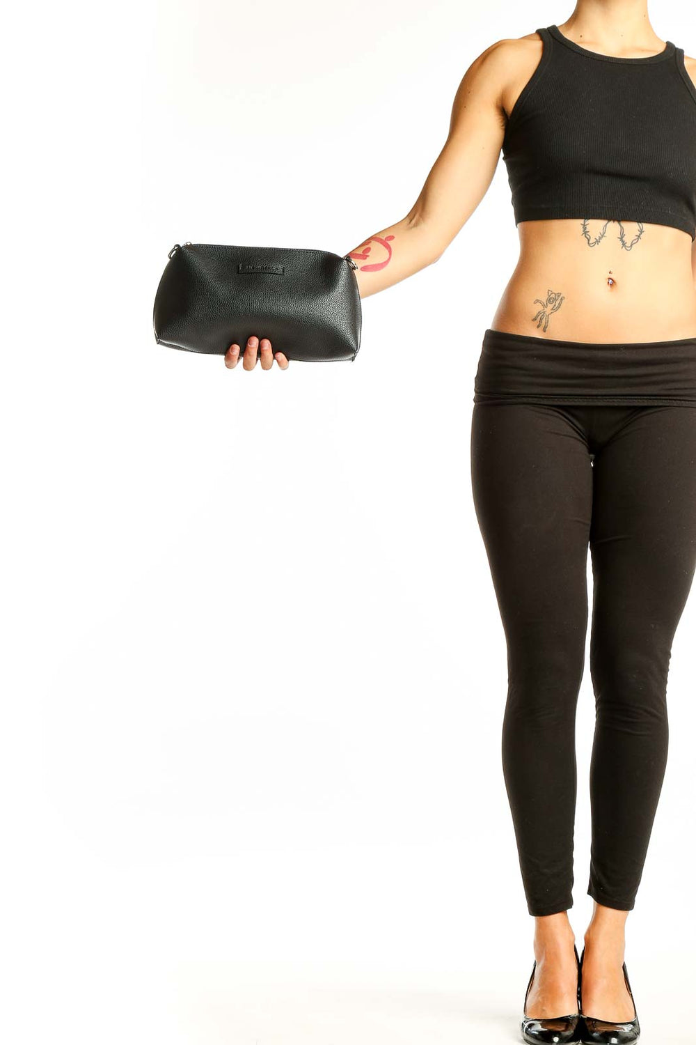 Front view of black leather NEWBELLA clutch purse held in hand