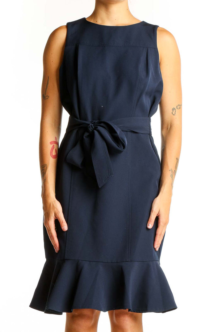 Front view of London Times navy sleeveless dress with flounce hem and waist tie