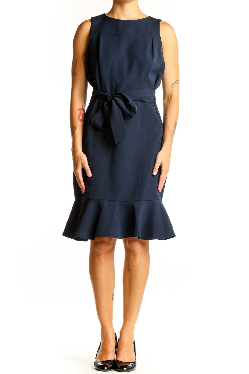 Front view of London Times navy sleeveless dress with flounce hem and waist tie