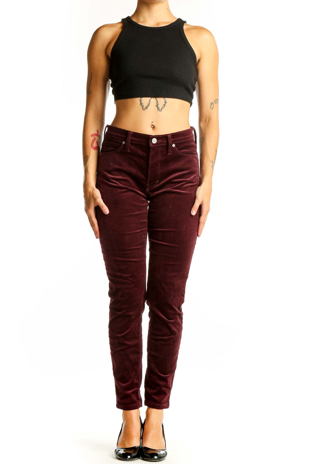 Front view of Banana Republic burgundy velvet slim-fit pants on model