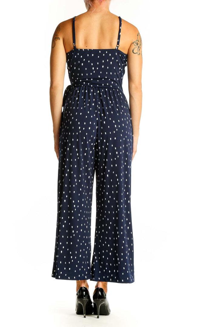 Side view of Kaileigh Navy Polka Dot Wrap Jumpsuit showing elasticated waist and pockets
