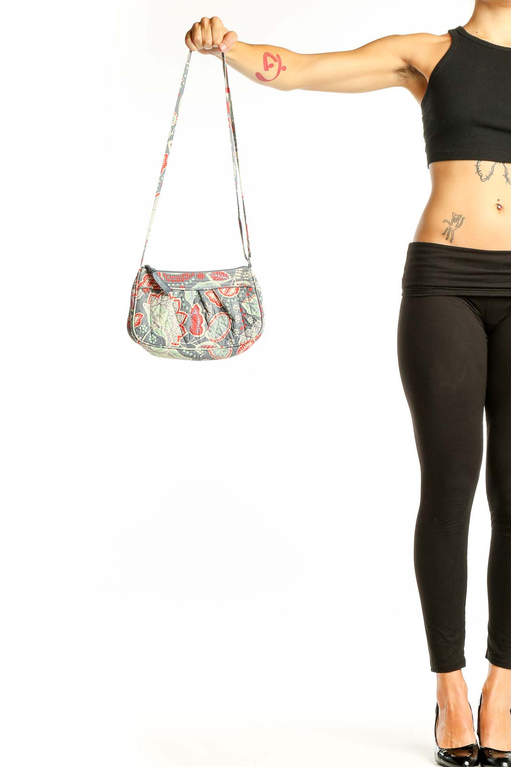 Front view of Vera Bradley gray floral print crossbody bag with coral and mint accents