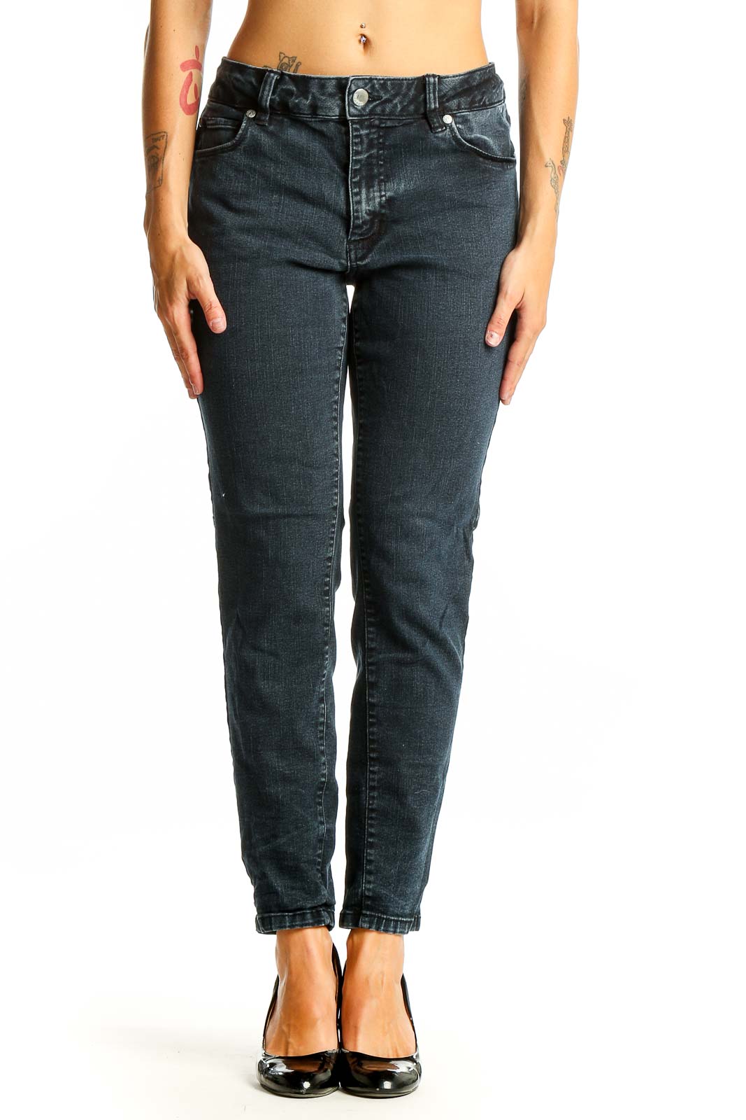 Front view of Tahari dark blue tapered denim jeans on model