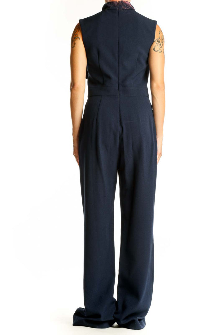 Side view of Harper Rose navy sleeveless jumpsuit showing wide-leg design