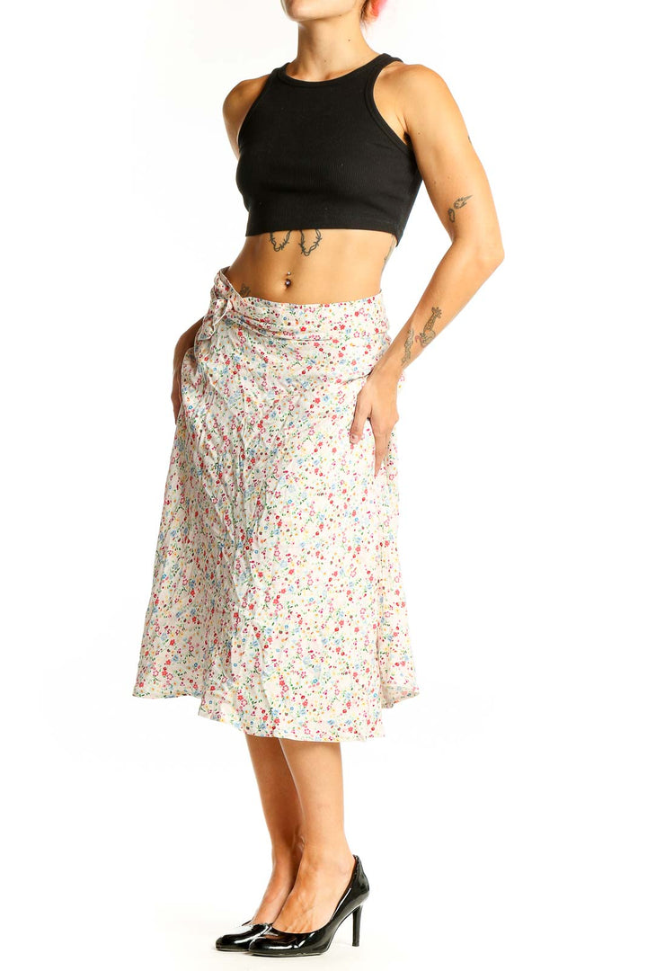 Front view of Corset Story white floral print midi skirt on model