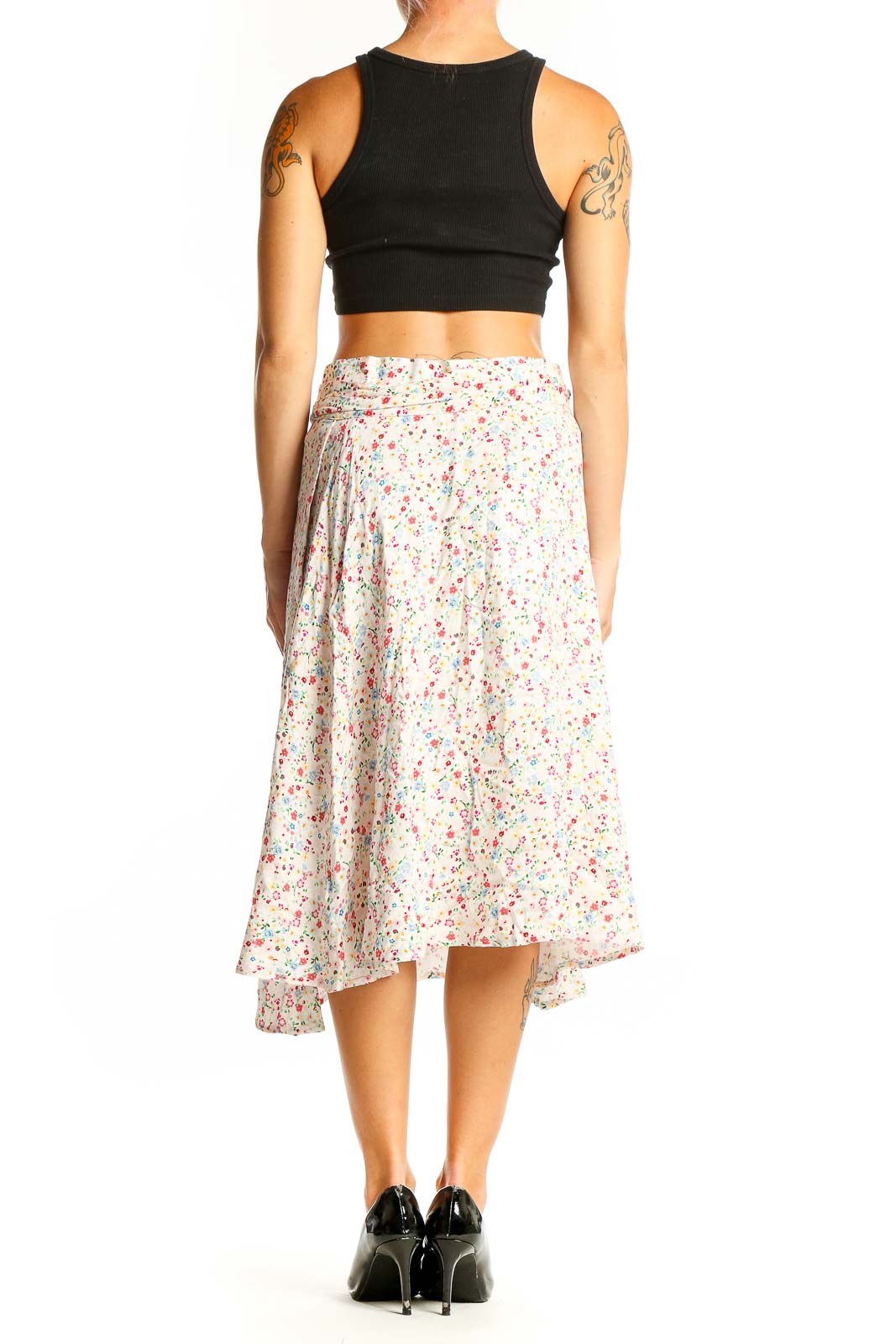 Side view of Corset Story white floral print midi skirt with black crop top