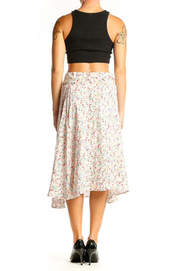 Side view of Corset Story white floral print midi skirt with black crop top