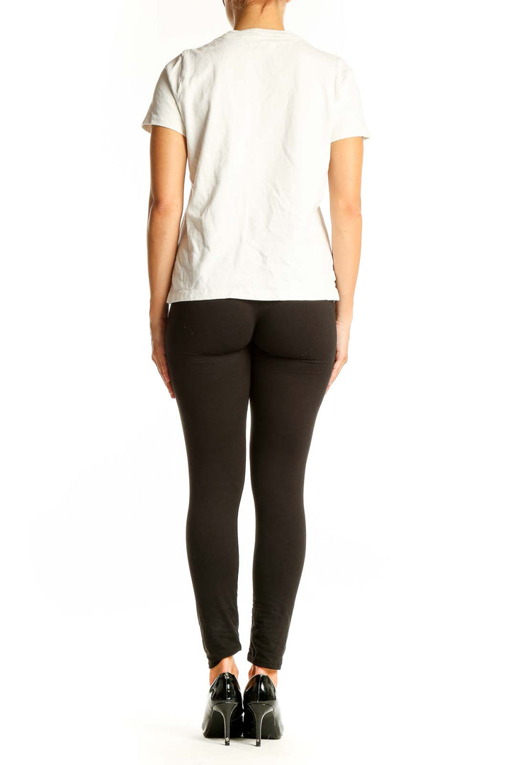 Side view of white Madewell t-shirt showing fit and side slits