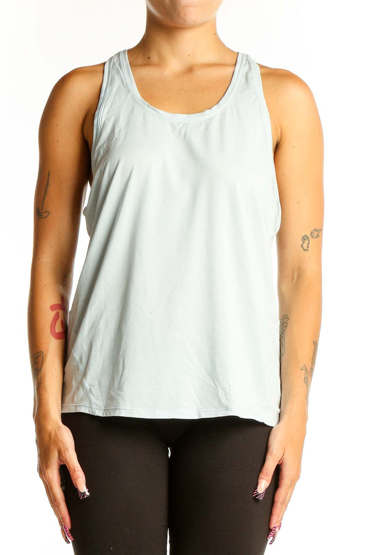 Front view of light blue Sweaty Betty tank top with racerback design
