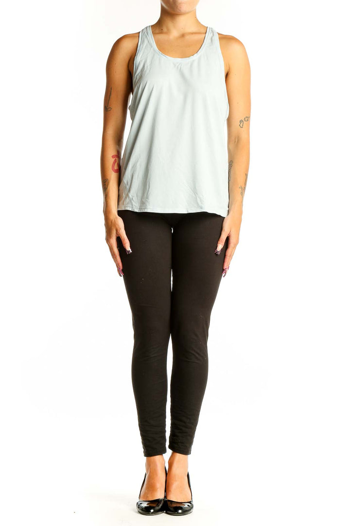 Front view of light blue Sweaty Betty tank top with racerback design