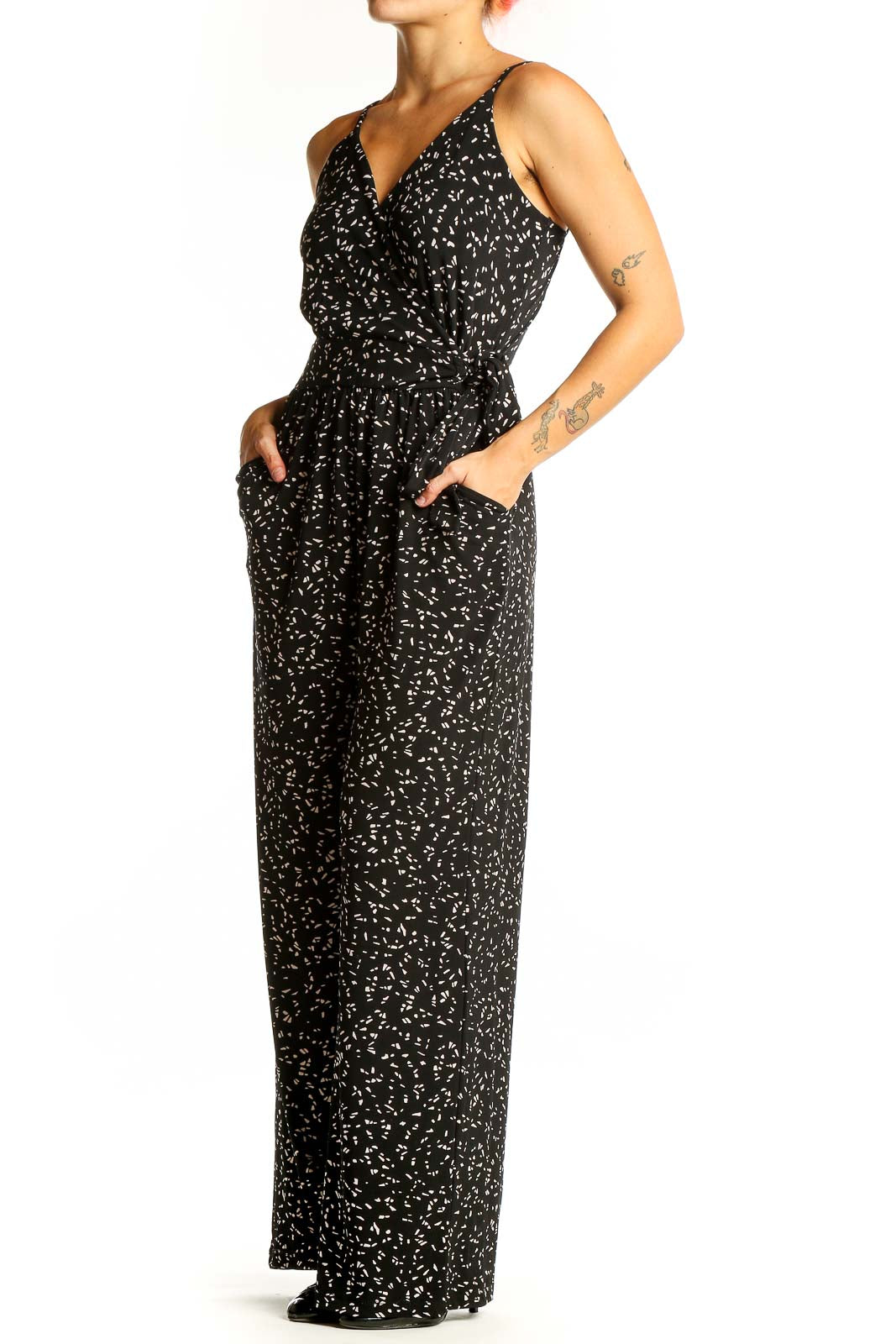 Front view of Kaileigh black floral print jumpsuit with V-neck and wide-leg design
