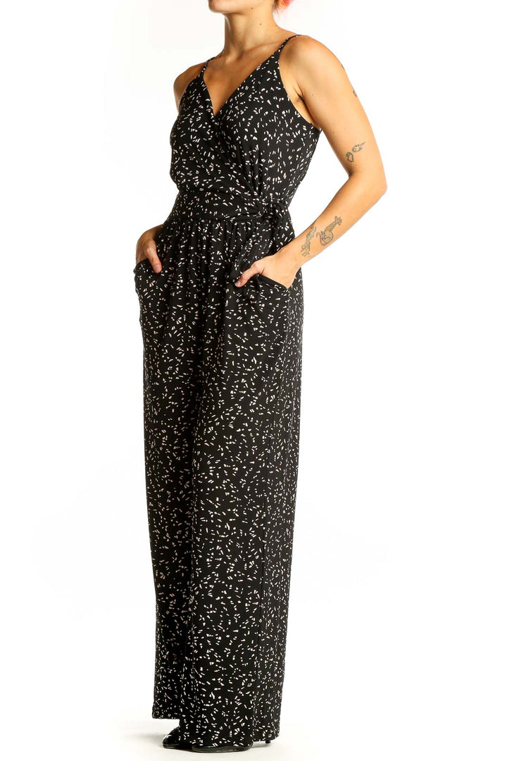 Front view of Kaileigh black floral print jumpsuit with V-neck and wide-leg design
