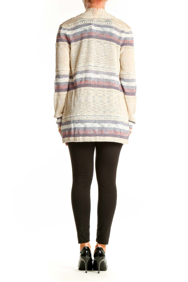Side view of model wearing Lety & Me cream striped open front cardigan
