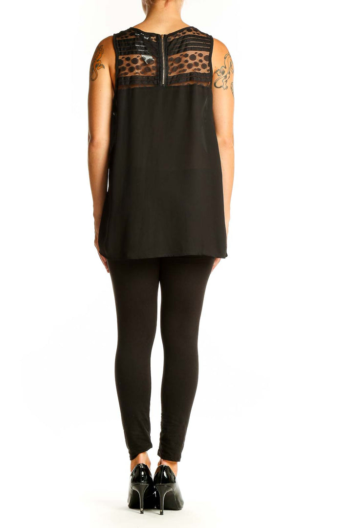 Side view of Papermoon Black Sleeveless Top showing flowy silhouette