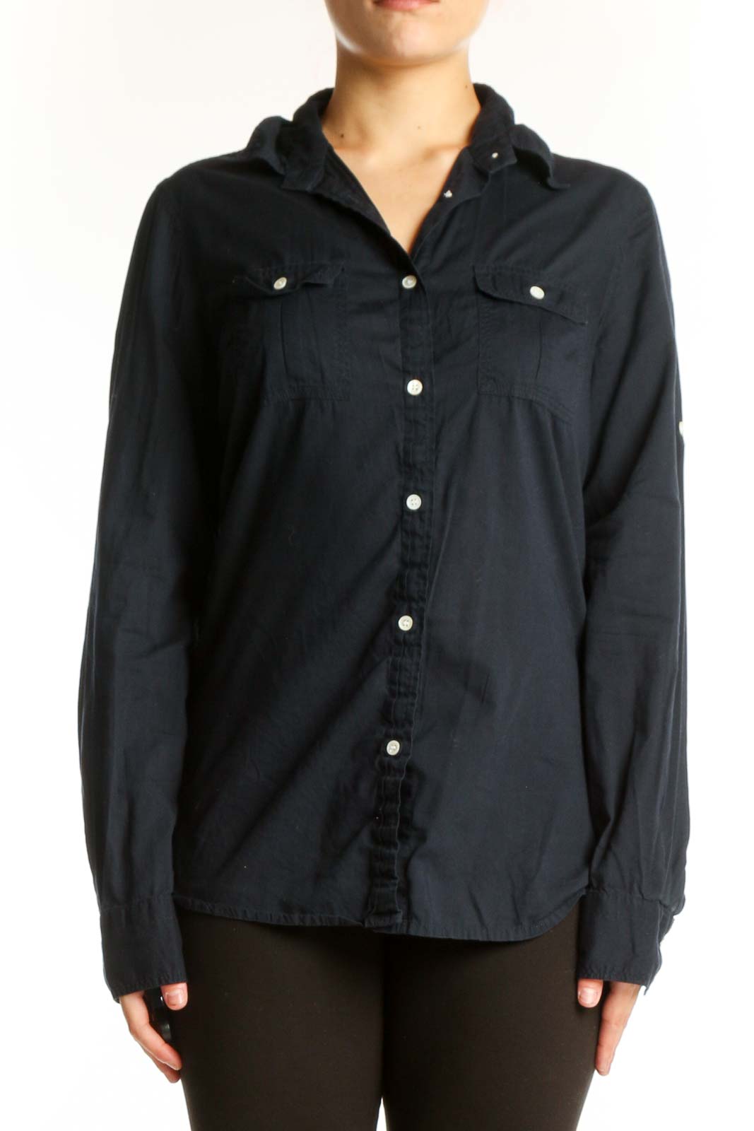 Navy cotton button-up shirt with pearl buttons and chest pockets, front view on model