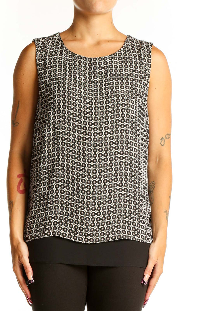 Front view of Rose + Olive black and white geometric print sleeveless top