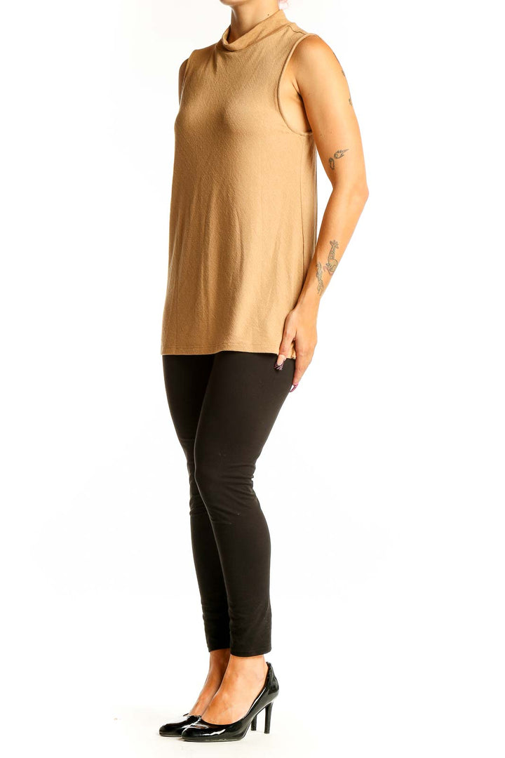 Front view of camel sleeveless mock neck top from Banana Republic