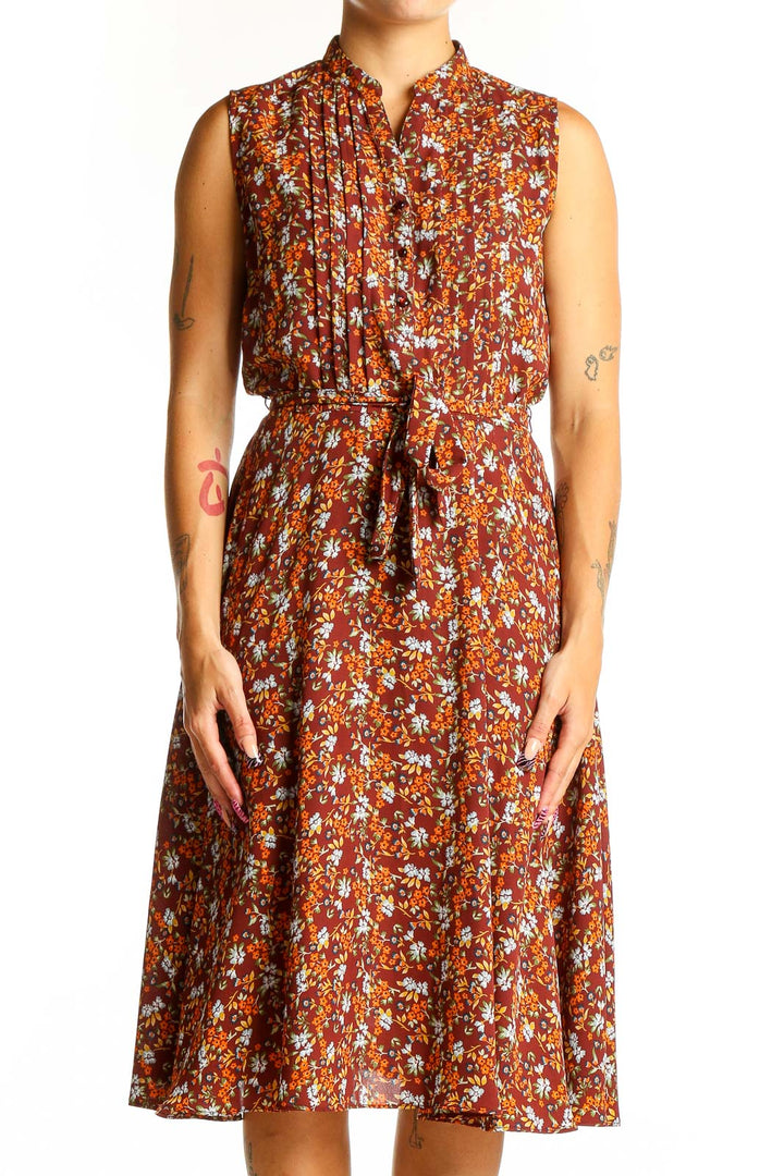 Front view of Nanette Lepore rust floral print sleeveless midi dress with tie belt