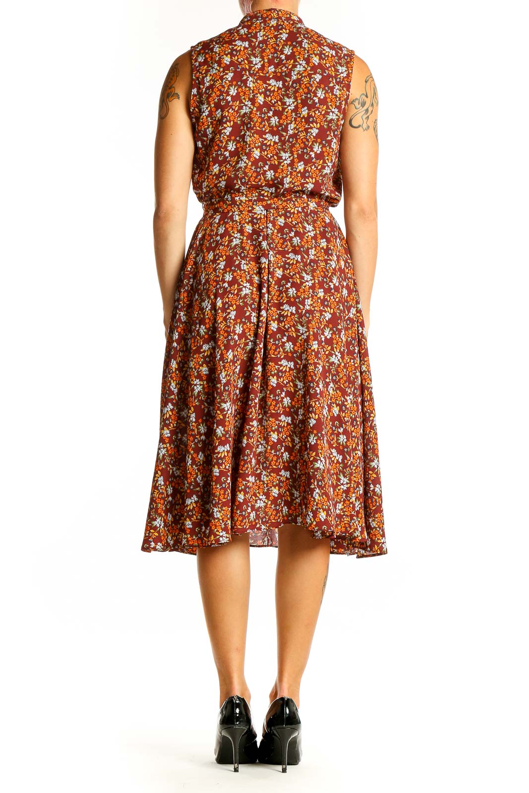 Side view of Nanette Lepore rust floral print sleeveless midi dress showing flowy skirt