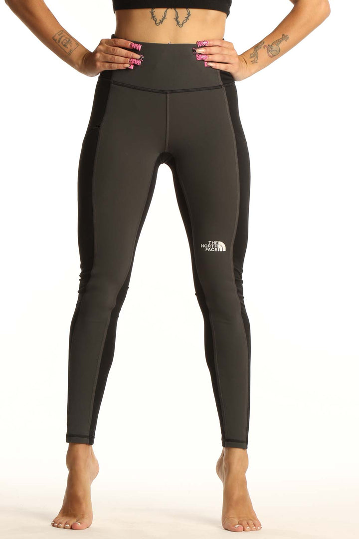 Front view of The North Face dark green high-waisted leggings