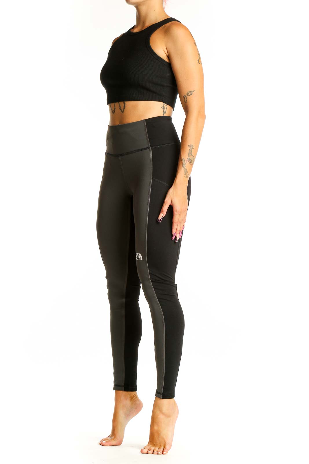 Front view of The North Face dark green high-waisted leggings