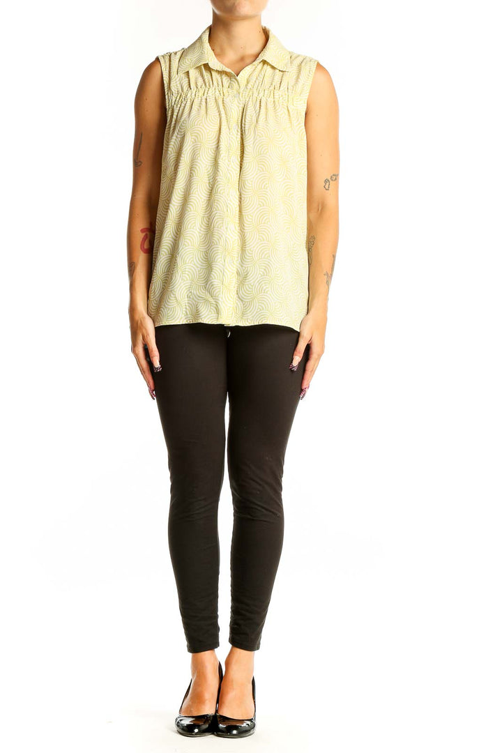Front view of Pleione yellow sleeveless blouse with swirl pattern