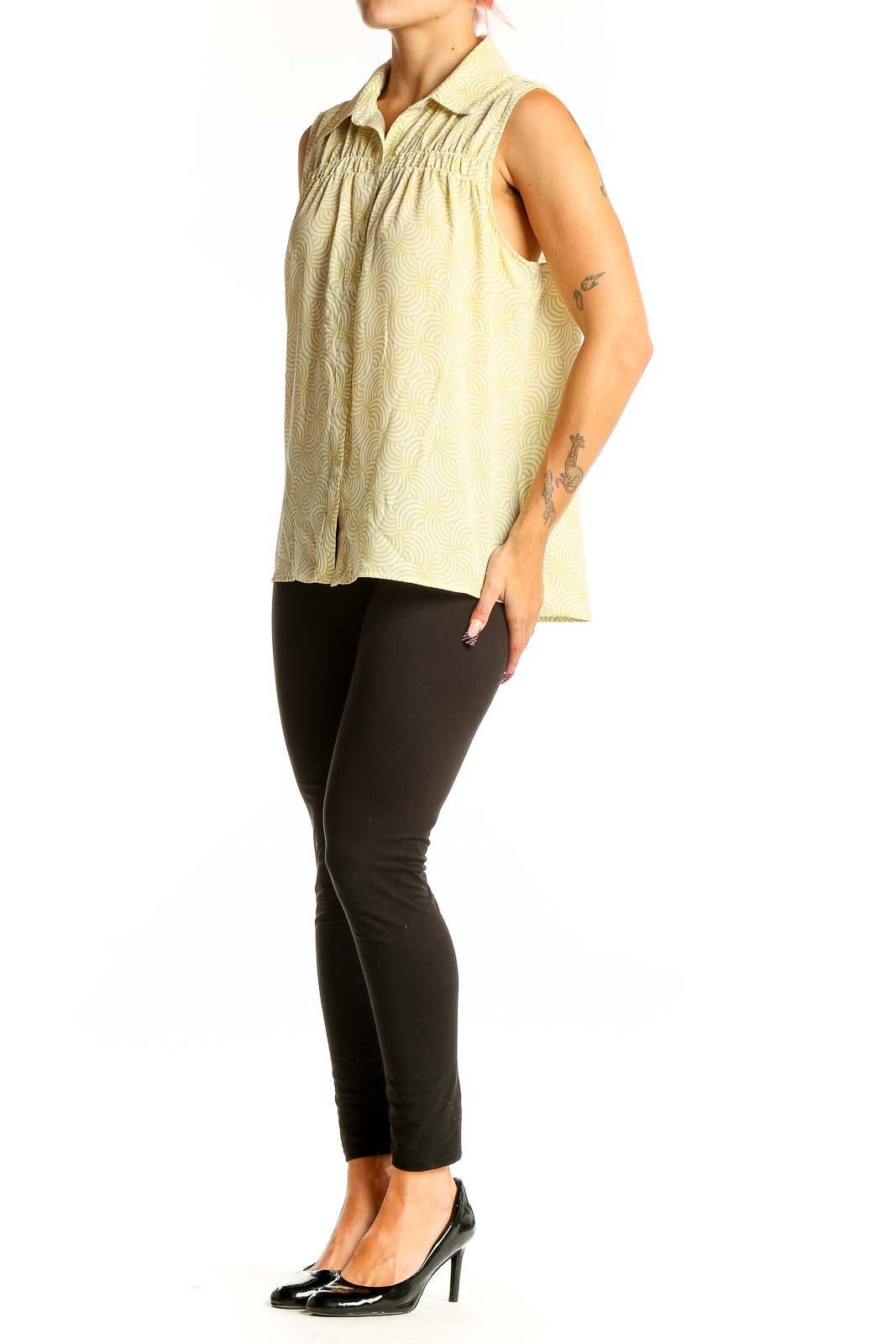 Front view of Pleione yellow sleeveless blouse with swirl pattern