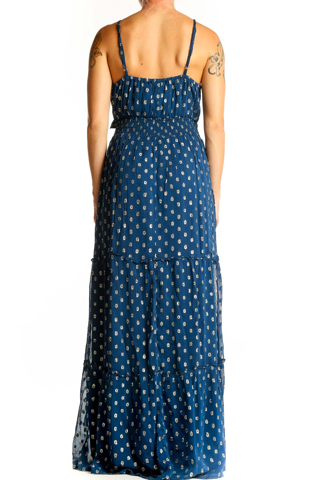 Back view of En Creme blue metallic polka dot maxi dress showing tiered skirt