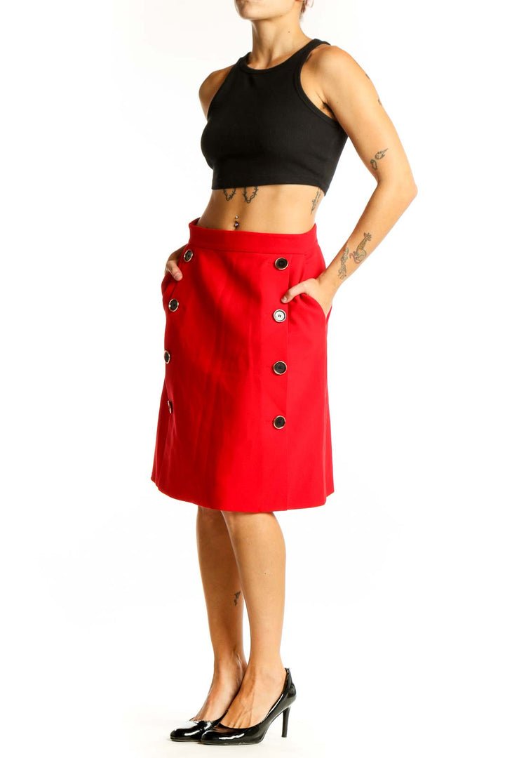 Front view of red Karen Millen A-line skirt with decorative buttons